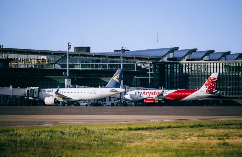 Kazakhstan's Air Astana and FlyArystan aircraft at the airport